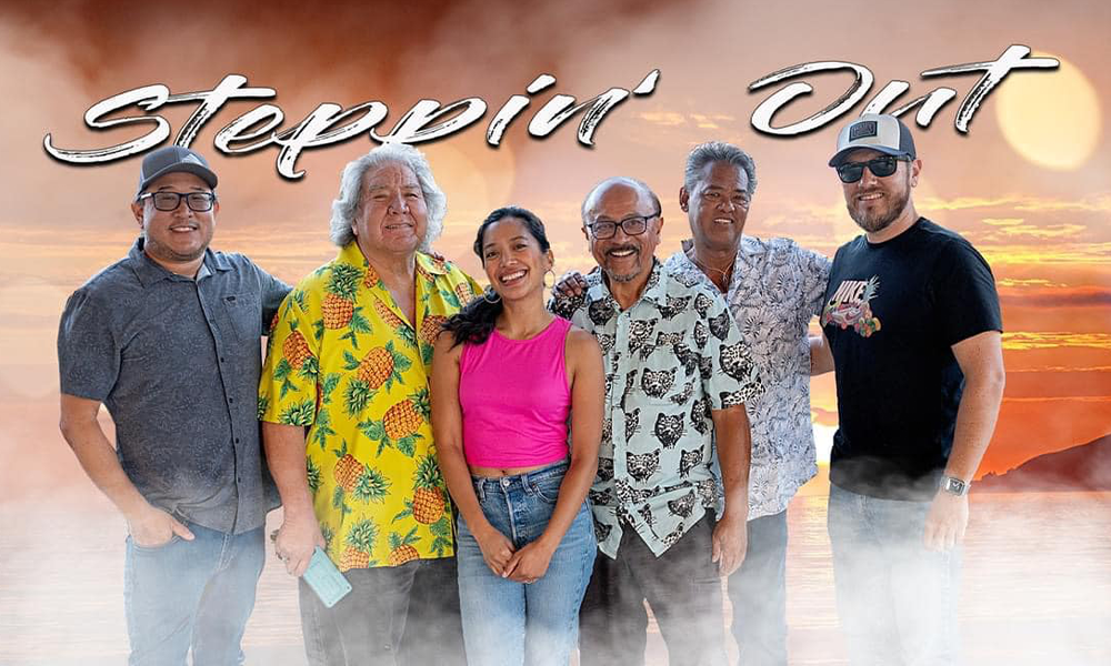 Image of the Steppin Out Band standing in front of a beach sunset.